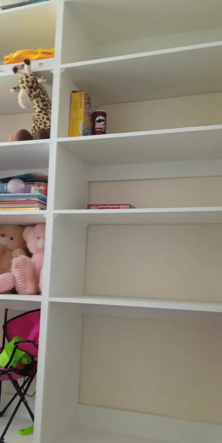 Custom-built white shelving and storage unit