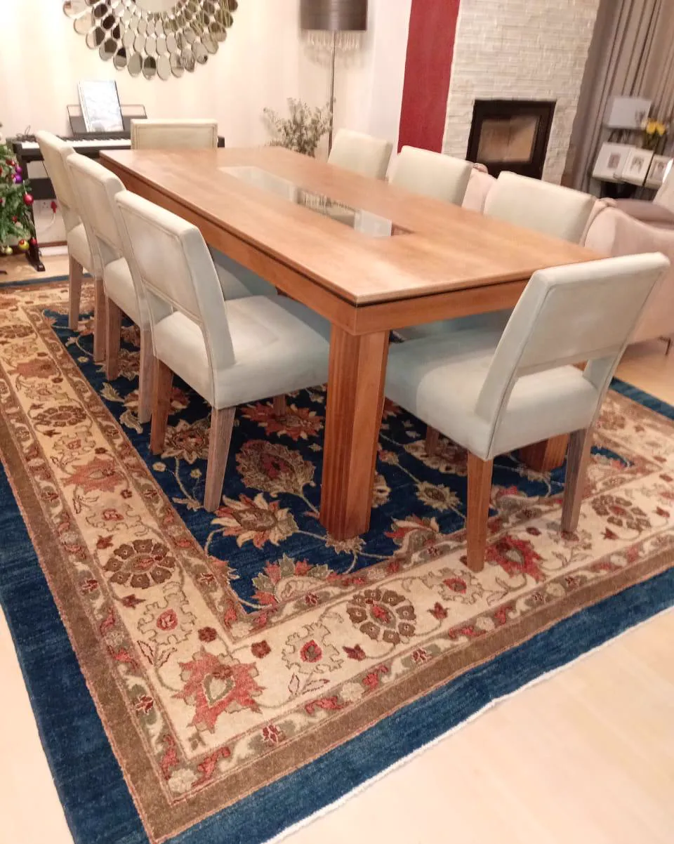 Custom solid timber dining table with upholstered chairs