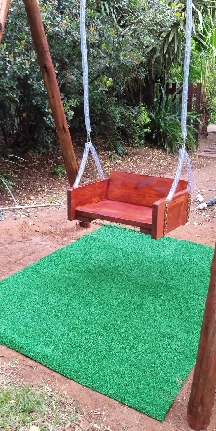 Completed handcrafted garden swing with stained finish