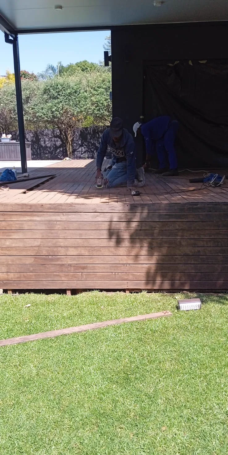 Raised timber garden deck with staircase to the lawn